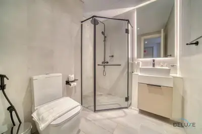 a bathroom with a shower and a toilet and a sink at Prime Studio at Mesk 1 Midtown Dubai Production City by Deluxe Holiday Homes in Dubai