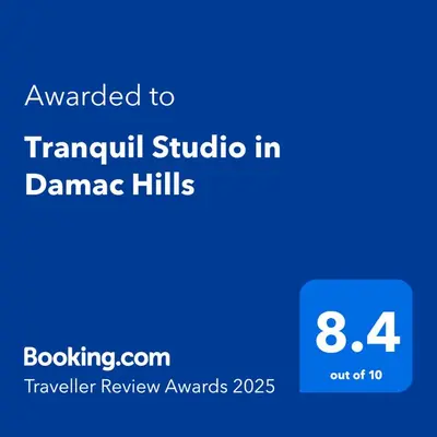 a screenshot of a cell phone with the text awarded to tramuu studio in at Tranquil Studio in Damac Hills in Dubai