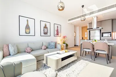 a living room with a couch and a table at Address JBR: Beachfront Bliss & Sky-high Luxury in Dubai