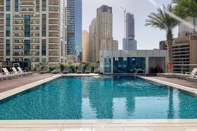 a large swimming pool in the middle of a city at Frank Porter - Botanica Tower 1 in Dubai