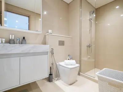 a bathroom with a toilet and a shower at Superior 1BR In Burj Royale - Downtown Dubai in Dubai