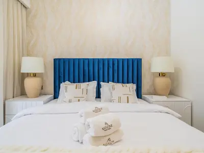a bedroom with two beds with towels on them at Superior 1BR In Burj Royale - Downtown Dubai in Dubai