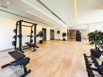 a gym with treadmills and exercise equipment in a room at Superior 1BR In Burj Royale - Downtown Dubai in Dubai