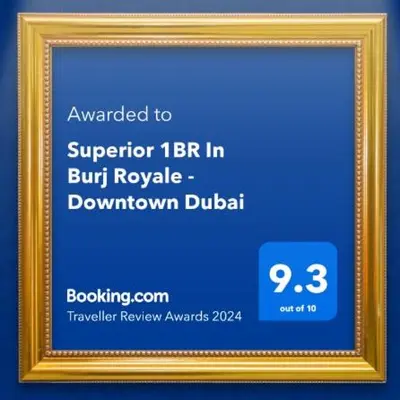 a gold picture frame with a blue background at Superior 1BR In Burj Royale - Downtown Dubai in Dubai