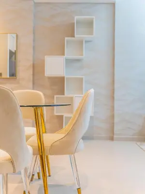 a dining room with a glass table and chairs at Radiant 1BR in Burj Royale - Downtown Dubai in Dubai