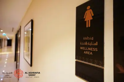 a sign on the wall of a wellness area at Alashrafia Saray- Wonderous Studio in Canal Views in Dubai