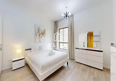 a white bedroom with a large white bed and a window at Upgraded 1Bedroom next to JBR Tourist Destination in Dubai