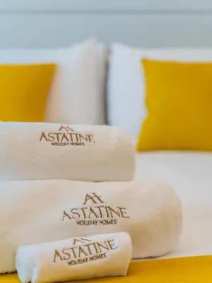 a pile of towels sitting on top of a bed at Paradise Studio in Palm Views - Palm Jumeirah in Dubai