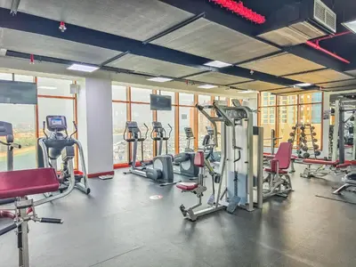 a gym with several treadmills and exercise bikes at Paradise Studio in Palm Views - Palm Jumeirah in Dubai