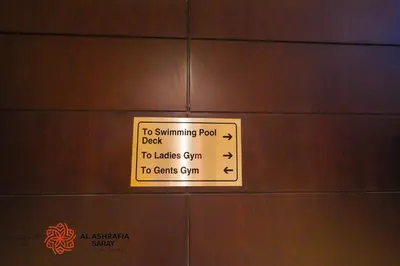 a sign is posted on the wall of a locker at Alashrafia Saray- Superior 1BR apartment in Sport City in Dubai
