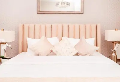 a bedroom with a white bed with white pillows at Elite Royal Apartment Full Burj Khalifa & Fountain View - Czar in Dubai