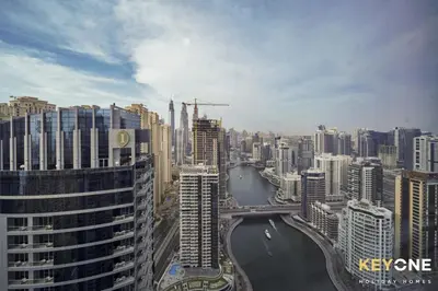a view of a city with a river and buildings at Chic Marina View Living in a Two Bedroom in Dubai