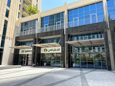an office building with glass doors in a courtyard at CitiHome- Modern- 1BR Creek Residence in Dubai