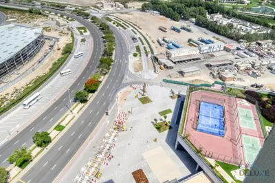 an aerial view of the construction of a football stadium at Picturesque Studio at Mesk 1 Midtown Dubai Production City by Deluxe Holiday Homes in Dubai