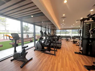 a gym with treadmills and ellipticals in a building at CitiHome - Newly Furnished Apartment in Business Bay in Dubai