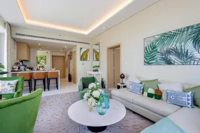 a living room with a couch and a table at Livbnb - 1BR w/Spectacular Sea Views in Palm Tower in Dubai