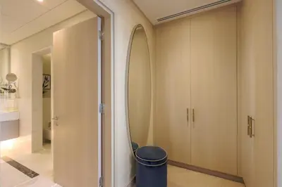 a hallway with a large mirror on the wall at Livbnb - 1BR w/Spectacular Sea Views in Palm Tower in Dubai