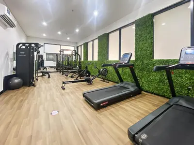 a gym with treadmills and exercise equipment in it at ALiving Duplex Studio I Aria Residence by Grovy, JVC in Dubai