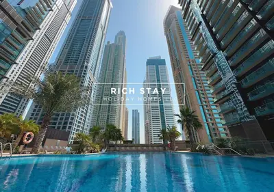 a swimming pool in a city with tall buildings at Phenomenal 1BR in Marina Gate 2,Full Marina View in Dubai