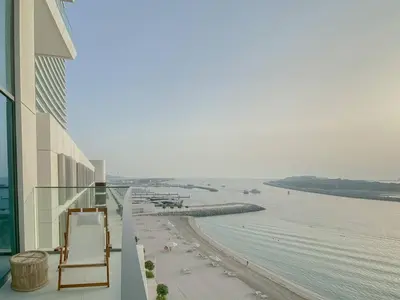 a balcony of a building with a view of the ocean at Trophy 2BDR Sandy Shores Retreat with Panoramic Sea View & Private Beach Access in Dubai