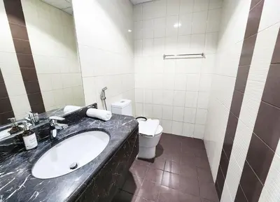 a bathroom with a sink and a toilet at RH- Luxurious Retreat, Spacious 01 BR, near Burj Khalifa and Dubai mall in Dubai
