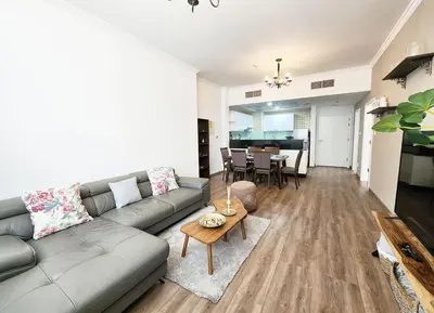 a living room with a couch and a table at RH- Luxurious Retreat, Spacious 01 BR, near Burj Khalifa and Dubai mall in Dubai