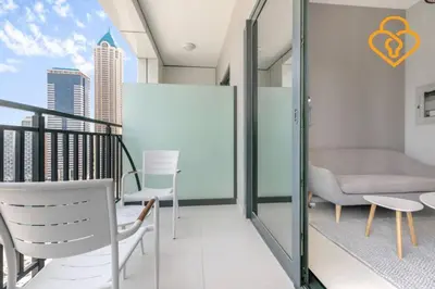 a balcony with chairs and a couch on a building at Keysplease New 1 BR Apt Business Bay, Zada Tower in Dubai