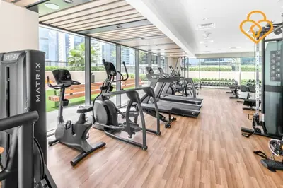 a gym with treadmills and cardio equipment in a building at Keysplease New 1 BR Apt Business Bay, Zada Tower in Dubai