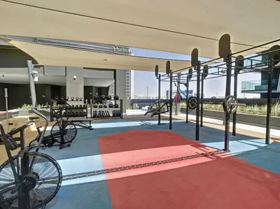 a room with a red carpet and bikes on a building at 15 Northside - Chic Studio in Dubai