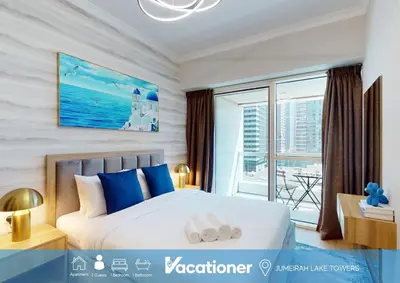 a bedroom with a large bed and a large window at Saba Tower 3 - Elegant Studio Apartment in Dubai