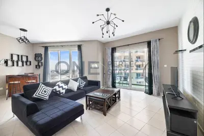 a living room with a couch and a table at Lake View All Bills Included Fully furnished in Dubai