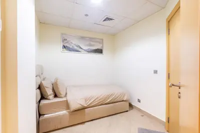 a bedroom with a bed in a room at Dubai The Palm 4BR Beach & Pool Access in Dubai