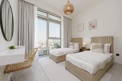 a hotel room with two beds and a mirror at Maison Privee - Graceful Apt in Prestigious Dubai Hills close to the Golf Course in Dubai