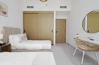 a hotel room with two beds and a mirror at Maison Privee - Graceful Apt in Prestigious Dubai Hills close to the Golf Course in Dubai