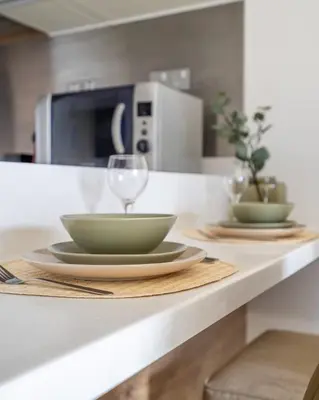 a counter with a bowl and a glass on it at GuestReady - Fashion Avenue | Burj Khalifa View in Dubai