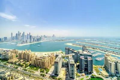 an aerial view of a city with a harbor at Heavenly Studio at The Palm Tower Palm Jumeirah by Deluxe Holiday Homes in Dubai