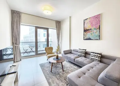 a living room with a couch and a table at RH- Captivating Skyline View, 02BR Near Clemance Medical Center in Dubai