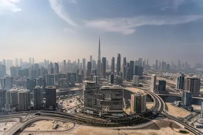 an aerial view of a large city with tall buildings at ALiving Elite 2BR I Burj Khalifa View I Paramount Towers, 6102 in Dubai