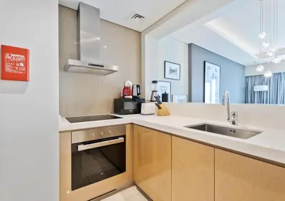 a kitchen with a sink and a counter top at ALiving Elite 2BR I Burj Khalifa View I Paramount Towers, 6102 in Dubai