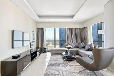 a living room with a couch and a table at ALiving Luxury 2BR I Paramount Towers, Business Bay- 6106 in Dubai