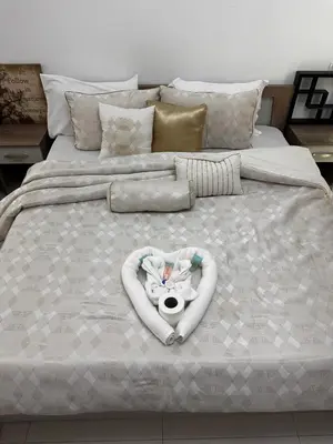 a bed with a baby in a heart shaped frame at Cute Rooms and Small Partitions for Girls in Dubai- Female guests only فتيات فقط in Dubai