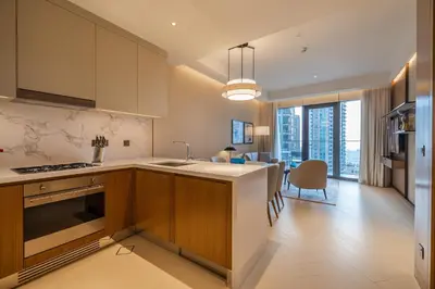 a kitchen with a sink and a counter top at Premium 1BDR Apartment in Downtown Opera in Dubai