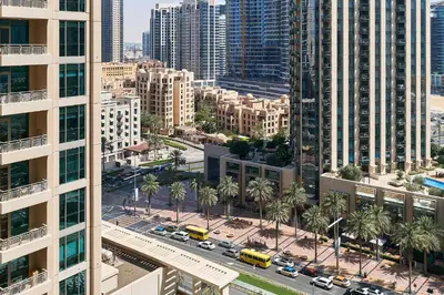 an aerial view of a city with tall buildings at Bellavista - Striking - 1BR with Extra Twin Room - 29 boulevard - Partial Fountain View in Dubai