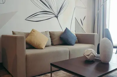a living room with a couch and a coffee table at Maison de Luxe - Jumeirah Living Marina Gate in Dubai