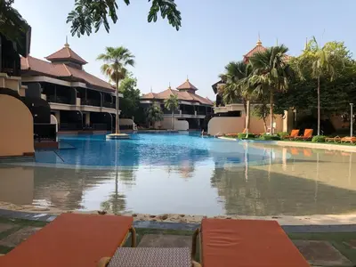 a large swimming pool in the middle of a resort at GuestReady - Posh Living with Burj Al Arab view in Dubai