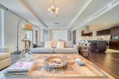 a living room with a couch and a table at Limestone House, Dubai International Financial Centre - Mint Stay in Dubai
