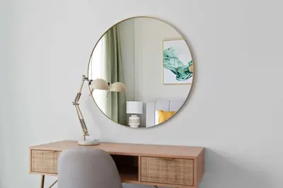 a mirror above a desk with a chair and a lamp at Silkhaus furnished 1BDR in Downtown new tower in Dubai