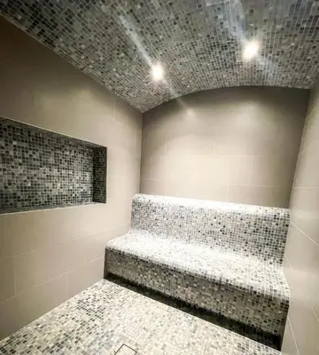 a room with a couch in a room with tiles at STAY BY LATINEM Luxury 2BR Holiday Home CV B601 near Burj Khalifa in Dubai