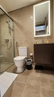 a bathroom with a toilet and a shower and a sink at STAY BY LATINEM Luxury 2BR Holiday Home CV B601 near Burj Khalifa in Dubai