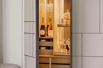 a cabinet with bottles of wine in it at One&Only One Za'abeel in Dubai